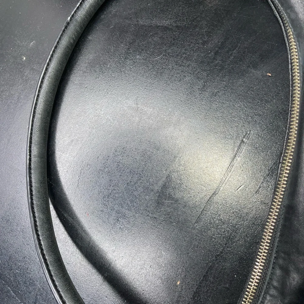 DKNY black leather shoulder bag with stud detailing.